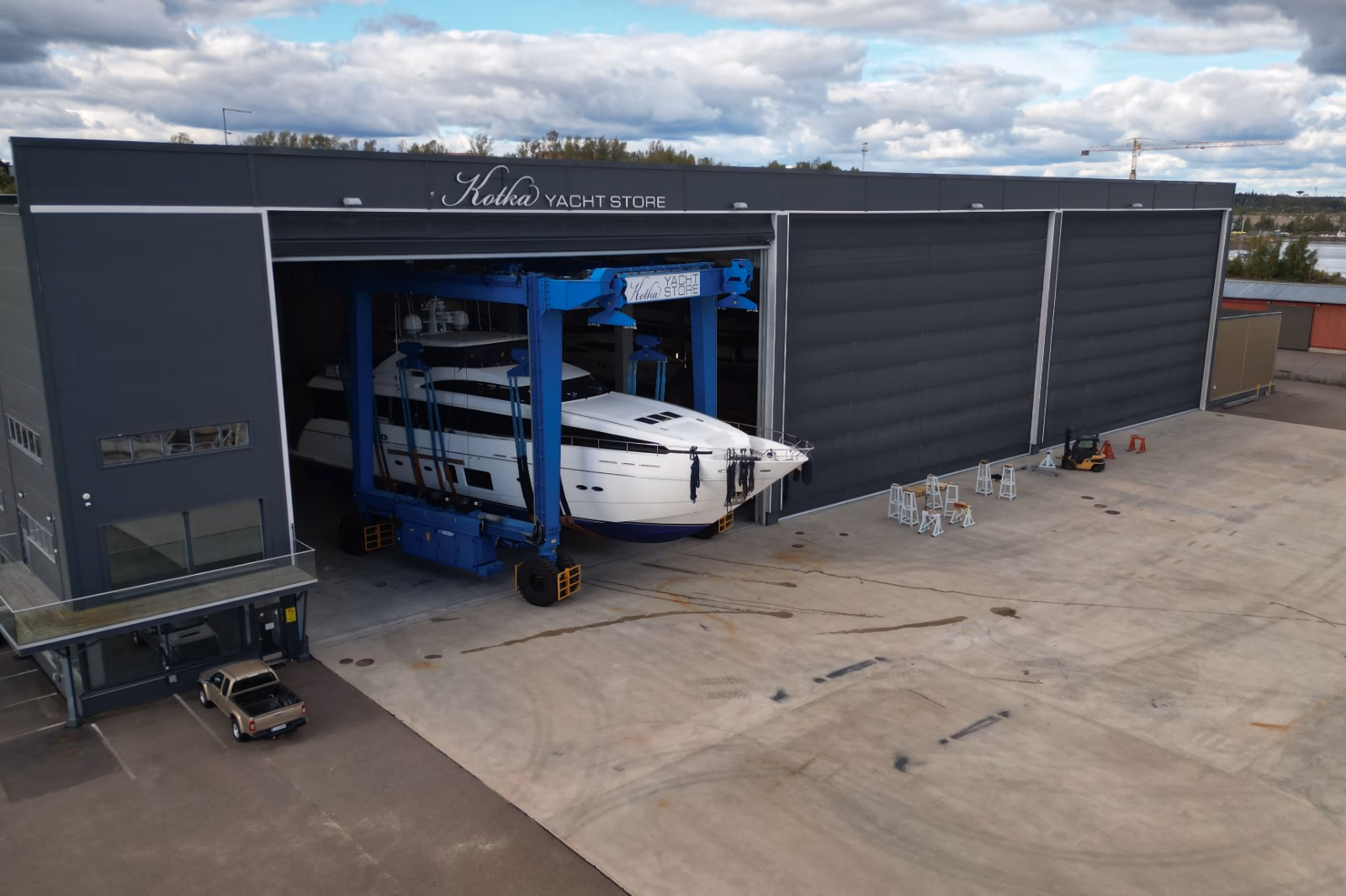 Kotka Yacht Store boatyard with a yacht on the travelift